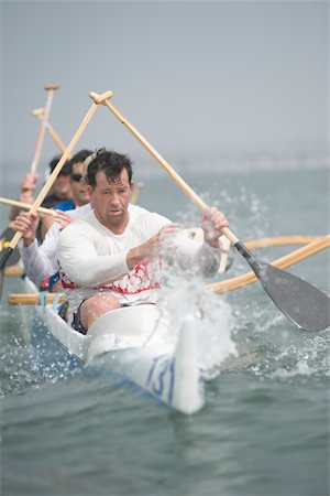 rowing (non sport) - Outrigger canoeing team on water Stock Photo - Premium Royalty-Free, Code: 693-03617076