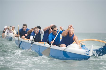 rowing team - Outrigger canoeing team on water Stock Photo - Premium Royalty-Free, Code: 693-03617071