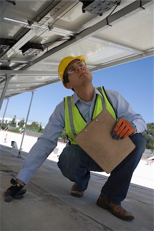 simsearch:693-03643971,k - Maintenance worker checking solar panel in Los Angeles, California Stock Photo - Premium Royalty-Free, Code: 693-03643960