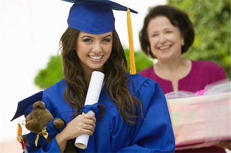 simsearch:693-06014177,k - Graduate holding teddy bear and diploma outside, portrait Stock Photo - Premium Royalty-Free, Code: 693-03686364