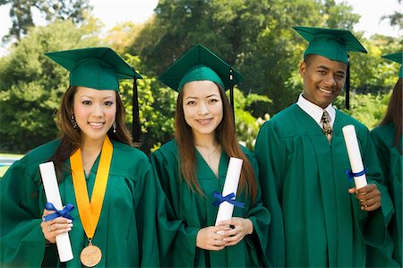 simsearch:693-06014177,k - Graduates hoisting diplomas outside university, portrait Stock Photo - Premium Royalty-Free, Code: 693-03686366
