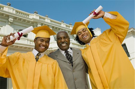 simsearch:693-06014177,k - Graduates with father outside university, low angle view, portrait Stock Photo - Premium Royalty-Free, Code: 693-03686368