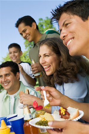 picnic family laugh - Boy (13-15) with family at outdoor picnic. Stock Photo - Premium Royalty-Free, Code: 693-03706945