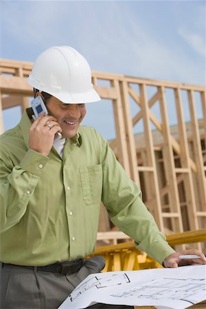 simsearch:693-06016727,k - Construction worker studying blueprint Stock Photo - Premium Royalty-Free, Code: 693-03707176