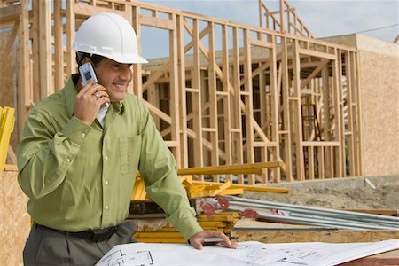 simsearch:693-06016727,k - Construction worker using mobile phone Stock Photo - Premium Royalty-Free, Code: 693-03707177