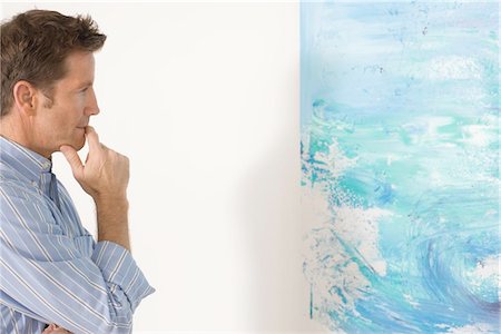 simsearch:693-05552760,k - Man contemplating paintings in gallery Stock Photo - Premium Royalty-Free, Code: 693-03707414