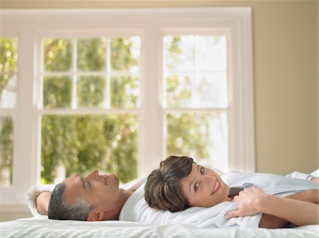 simsearch:693-03707745,k - Couple relaxing in bed Stock Photo - Premium Royalty-Free, Code: 693-03707499