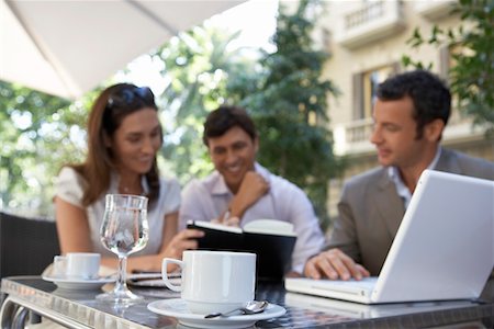 Businesspeople meeting at outdoor cafe Stock Photo - Premium Royalty-Free, Code: 693-03707581