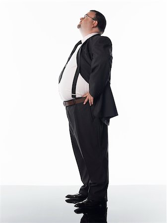 fat man full body - Overweight businessman, side view Stock Photo - Premium Royalty-Free, Code: 693-03707711