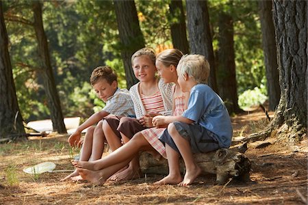 Four Children in Forest Stock Photo - Premium Royalty-Free, Code: 693-03707828