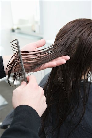 stylist - Wet hair is combed out in hair salon Stock Photo - Premium Royalty-Free, Code: 693-03782602