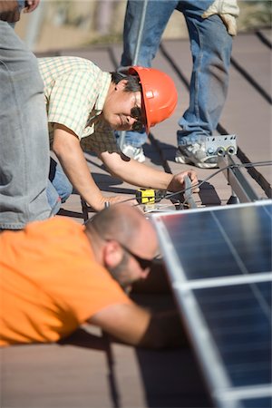 simsearch:693-03643971,k - A group of men working on solar panelling Stock Photo - Premium Royalty-Free, Code: 693-03782706