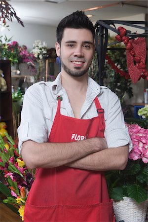 Florist stands with arms folded Stock Photo - Premium Royalty-Free, Code: 693-03782730