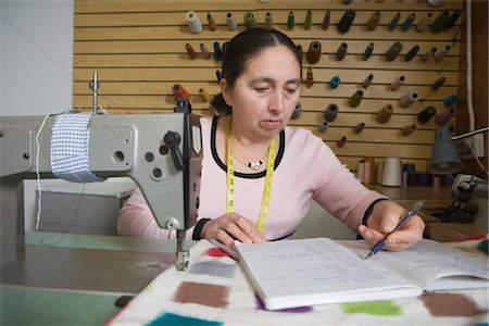 seamstress - Mature woman working in the laundrette Stock Photo - Premium Royalty-Free, Code: 693-03783080