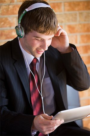 Businessman Using iPad Foto de stock - Con derechos protegidos, Código: 700-04163449