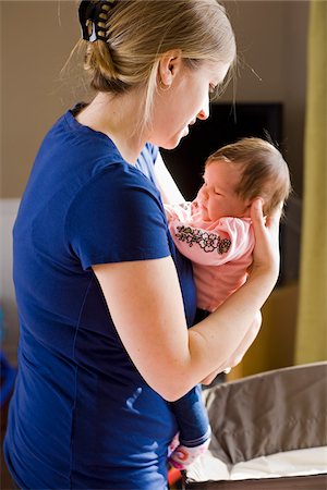 Woman Holding Baby Girl Foto de stock - Con derechos protegidos, Código: 700-04931796