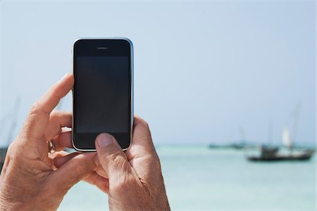 Man Taking Photos with iPhone Stock Photo - Rights-Managed, Code: 700-04981800
