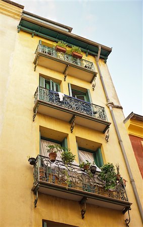 french door window - Low Angle View of Residential Building in Old Town, Nice, Cote d'Azur, France Stock Photo - Rights-Managed, Code: 700-05560329