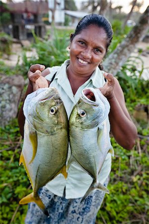 success smile outdoors - Woman Holding Freshly Caught Fish, Ahangama, Sri Lanka Stock Photo - Rights-Managed, Code: 700-05642149