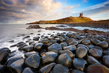 stone in water - View of Dunstanburgh Castle, Embleton Bay, Northumberland, England Stock Photo - Rights-Managed, Code: 700-05803725