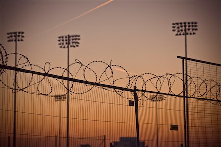 fenced in - Floodlights and Fence at Olympic Park, Pudding Mill Lane, Stratford, London, England Stock Photo - Rights-Managed, Code: 700-05822003