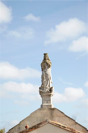 statues on building top - Statue on top of Chapel, Ars-en-Re, Charente-Maritime, Poitou-Charentes, France Stock Photo - Rights-Managed, Code: 700-05854185