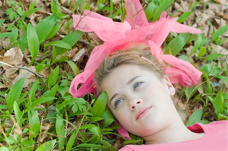 Teenage Girl Lying on Ground Stock Photo - Rights-Managed, Code: 700-05973477