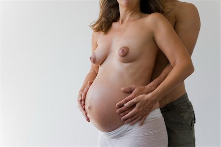 expecting - Pregnant Couple in Studio Stock Photo - Rights-Managed, Code: 700-05973491