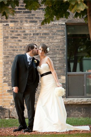 stylish couple - Groom Kissing Bride on Cheek Stock Photo - Rights-Managed, Code: 700-05973646