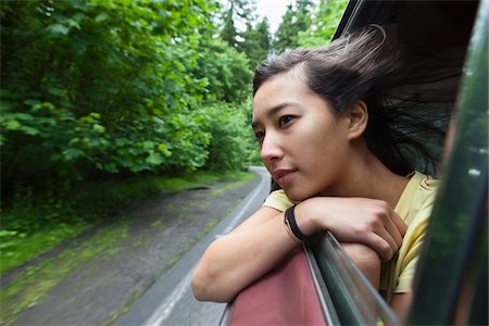 passenger (female) - Young Woman Looking Out Car Window Stock Photo - Rights-Managed, Code: 700-06190611