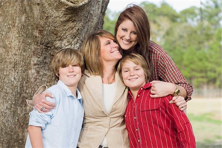 son hugging mom - Portrait of Mother with Children Stock Photo - Rights-Managed, Code: 700-06282095