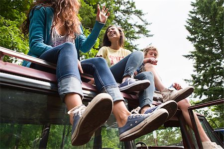 ethnic group of friends - Group of People Sitting on Roof of Car Stock Photo - Rights-Managed, Code: 700-06334614