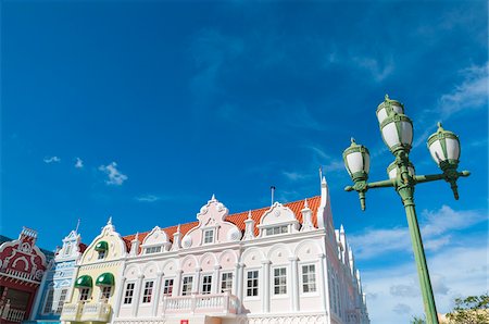 simsearch:600-06431260,k - Pastel Coloured Dutch Colonial Buildings and Street Lamp, Oranjestad, Aruba, Lesser Antilles, Dutch Antilles Photographie de stock - Rights-Managed, Code: 700-06439080