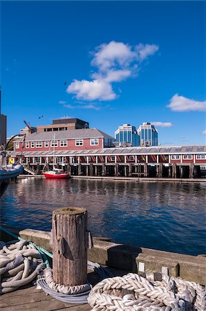 east coast canada - Post and Ropes on Dock at Harbor with Buildings in Background, Halifax, Nova Scotia, Canada Stock Photo - Rights-Managed, Code: 700-06439179