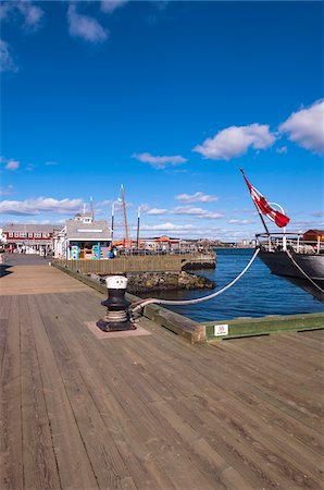 east coast canada - Boat Tied up at Dock in Halifax Harbor with Cafes in Background, Halifax, Nova Scotia, Canada, Stock Photo - Rights-Managed, Code: 700-06439183