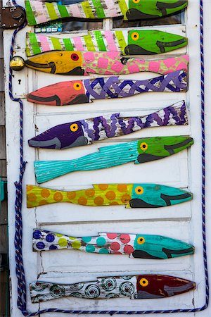 Pieces of Wood Painted as Coloful Fish on Wooden Door Stock Photo - Rights-Managed, Code: 700-06465785