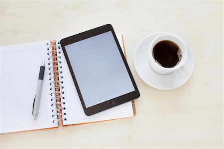 pupitre - still life of a tablet pc, notebook, pen, and a cup of coffee Foto de stock - Con derechos protegidos, Código: 700-06701965