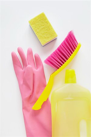 still life of cleaning products including sponge, bottle of cleaner, rubber glove, and hand broom Foto de stock - Con derechos protegidos, Código: 700-06714081