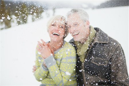 simsearch:600-06752300,k - Selective focus portrait of couple laughing in the snow. Stock Photo - Rights-Managed, Code: 700-06752635