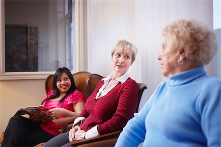 elderly lady talking to people - Three female patients in dental office waiting area. Stock Photo - Rights-Managed, Code: 700-06786944