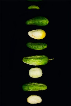 eight (quantity) - a variety of fresh local organic artisanal farm-grown cucumbers on black, jeffersonville, georgia Stock Photo - Rights-Managed, Code: 700-06841809