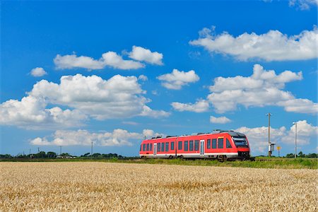 passenger train not subway not training - Regional Train Traveling through Fields in Summer, Toenning, Eiderstedt Peninsula, Schleswig-Holstein, Germany Stock Photo - Rights-Managed, Code: 700-06899718