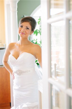 Portrait of Bride standing at door, looking at camera and smiling Stock Photo - Rights-Managed, Code: 700-06939697