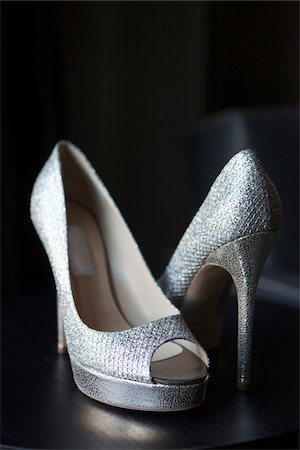 stiletto heels - Close-up of silver dress shoes, studio shot on black background Stock Photo - Rights-Managed, Code: 700-06961000