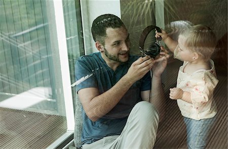 simsearch:700-06962061,k - Baby Girl and Father with Headphones at Home, Mannheim, Baden-Wurttemberg, Germany Stock Photo - Rights-Managed, Code: 700-06962025