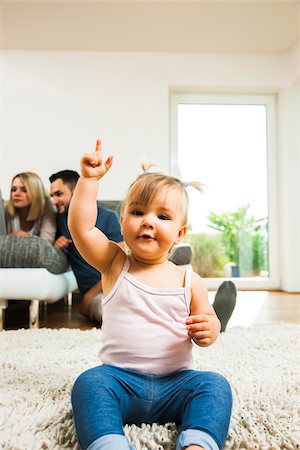 daughter with dad in home - Family in Living Room at Home, Mannheim, Baden-Wurttemberg, Germany Stock Photo - Rights-Managed, Code: 700-06962051