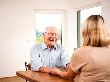 elderly lady talking to people - Senior Man and Young Woman Talking at Home, Mannheim, Baden-Wurttemberg, Germany Stock Photo - Rights-Managed, Code: 700-06962191