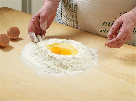 Close-up of elderly Italian woman making dough by hand in kitchen, Ontario Canada Stock Photo - Rights-Managed, Code: 700-07108328