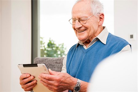 Portrait of Senior Man using Tablet Computer, Mannheim, Baden-Wurttemberg, Germany Stock Photo - Rights-Managed, Code: 700-07192188