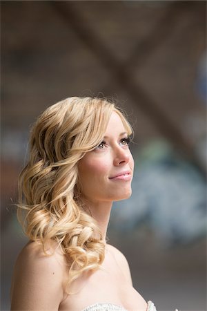 Close-up portrait of blond, woman standing outdoors looking upwards and smiling, Canada Stock Photo - Rights-Managed, Code: 700-07237591
